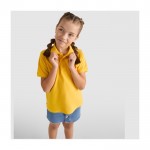 Polo en tricot piqué 100% coton pour enfants 200 g/m² Roly couleur jaune image nature morte