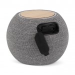 Enceinte et chargeur portable rond et compact en RPET et bambou couleur gris troisième vue